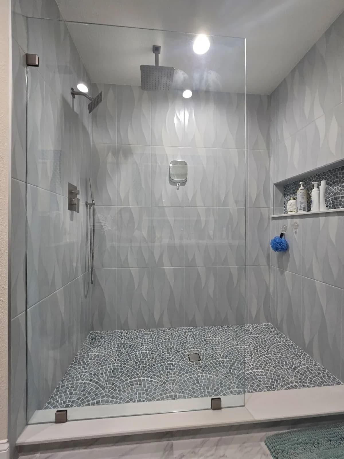 Large format porcelain tile shower wall in a Tampa Bay master bath