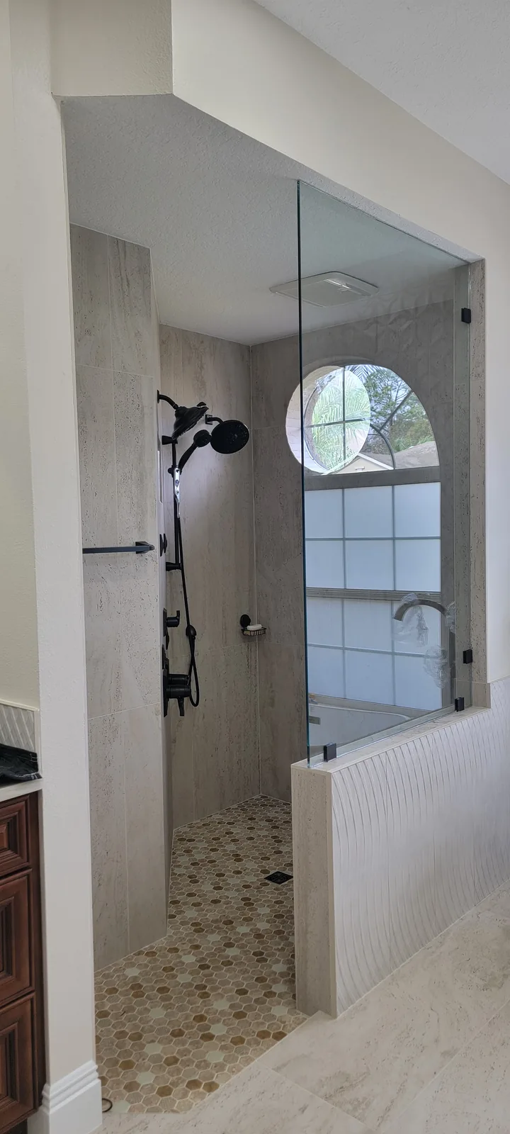 Frameless glass shower enclosure with custom tile work, Tampa Bay bathroom remodel (project 1)