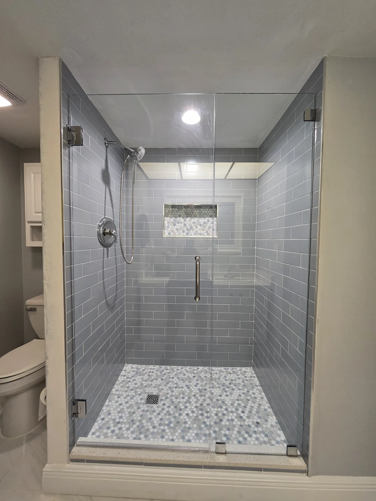 Frameless glass shower enclosure with custom tile work, Tampa Bay bathroom remodel (project 2)